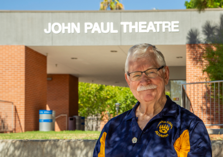 Marty Manning standing outside John Paul Theatre (2023)