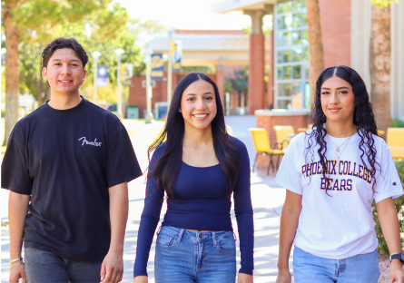 Three other PC Ambassadors walking across campus - two female one male