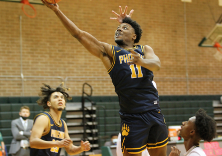 Mike going for a layup during a basketball game